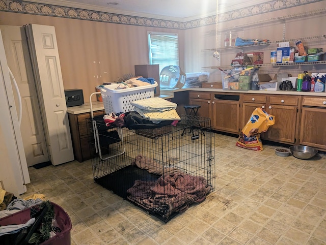 400 Verna Dr, Winchester, KY 40391 - kitchen with light countertops, brown cabinetry, ornamental molding, and light floors