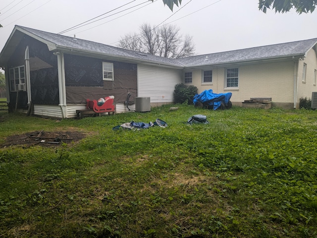 400 Verna Dr, Winchester, KY 40391 - back of property featuring a lawn, a sunroom, central AC unit, and brick siding