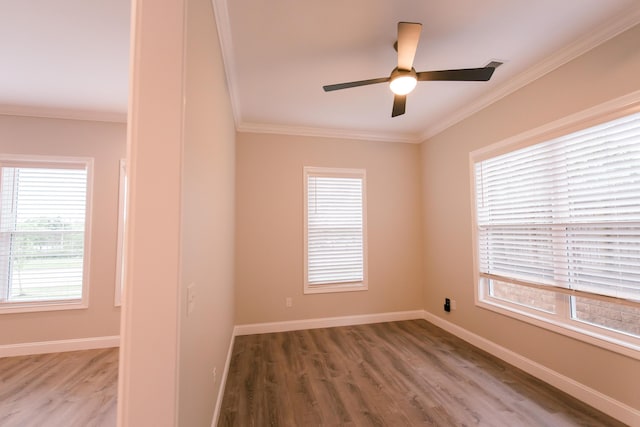4299 Captains Ct, Lexington, KY 40513 - empty room with crown molding, wood finished floors, plenty of natural light, a ceiling fan, and baseboards