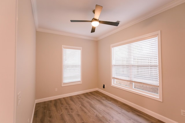 4299 Captains Ct, Lexington, KY 40513 - empty room featuring ornamental molding, healthy amount of natural light, ceiling fan, wood finished floors, and baseboards