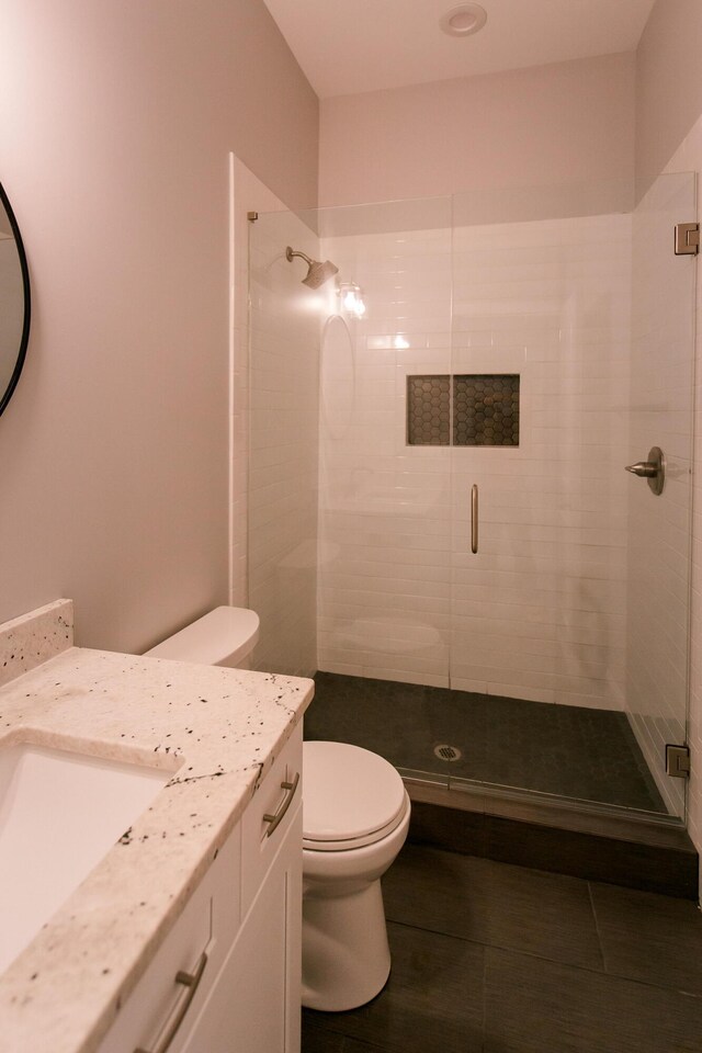4299 Captains Ct, Lexington, KY 40513 - bathroom featuring toilet, vanity, and a shower stall