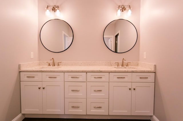 4299 Captains Ct, Lexington, KY 40513 - bathroom with double vanity and baseboards
