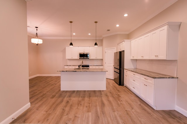 4299 Captains Ct, Lexington, KY 40513 - kitchen featuring stainless steel microwave, freestanding refrigerator, ornamental molding, decorative backsplash, and baseboards
