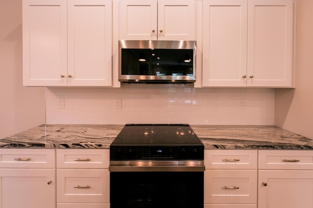 4299 Captains Ct, Lexington, KY 40513 - kitchen featuring appliances with stainless steel finishes, white cabinets, and decorative backsplash