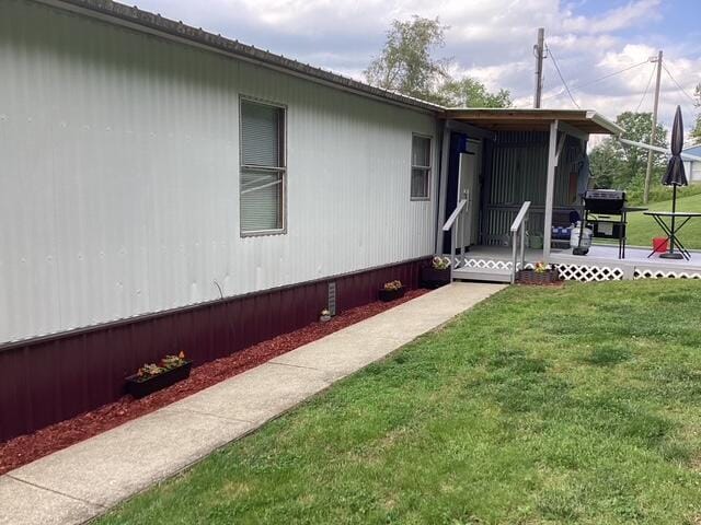 700 Rube Brown Rd, Hustonville, KY 40437 - view of home's exterior with a yard and a wooden deck