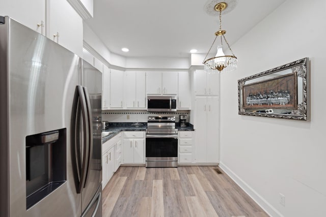 6A Charleston Greene, Danville, KY 40422 - kitchen featuring appliances with stainless steel finishes, dark countertops, light wood-type flooring, white cabinetry, and recessed lighting