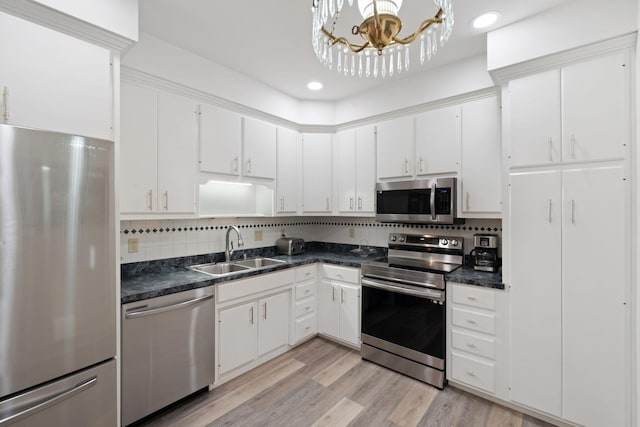 6A Charleston Greene, Danville, KY 40422 - kitchen with stainless steel appliances, a sink, dark countertops, white cabinets, and recessed lighting
