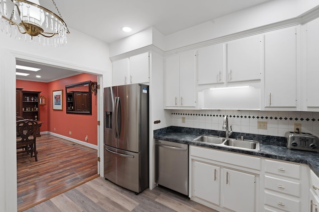 6A Charleston Greene, Danville, KY 40422 - kitchen featuring appliances with stainless steel finishes, a sink, dark countertops, decorative backsplash, and recessed lighting