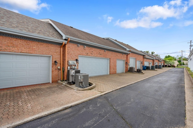 6A Charleston Greene, Danville, KY 40422 - view of home's exterior with brick siding, a shingled roof, and cooling unit