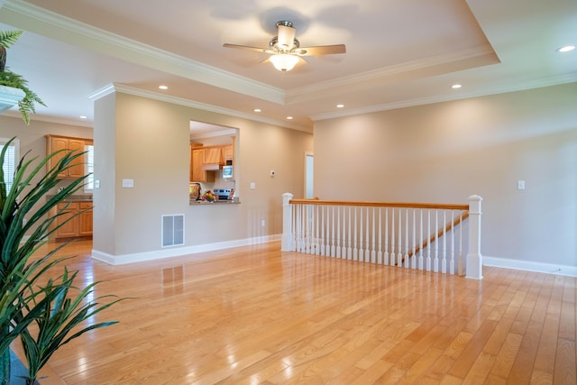 20 Walnut Hill Ct, Cynthiana, KY 41031 - empty room with light wood-type flooring, crown molding, baseboards, ceiling fan, and a raised ceiling