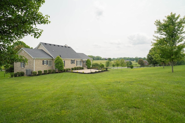 20 Walnut Hill Ct, Cynthiana, KY 41031 - view of green lawn with a patio area and central AC unit
