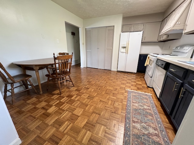 155 Greenfield Subdivision, Corbin, KY 40701 - kitchen featuring white appliances, light countertops, a textured ceiling, and baseboards