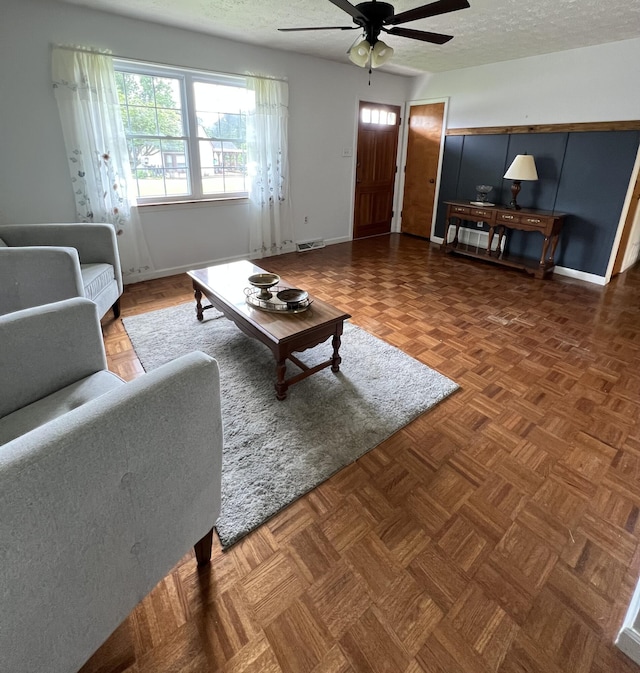 155 Greenfield Subdivision, Corbin, KY 40701 - living area with ceiling fan, a textured ceiling, and baseboards