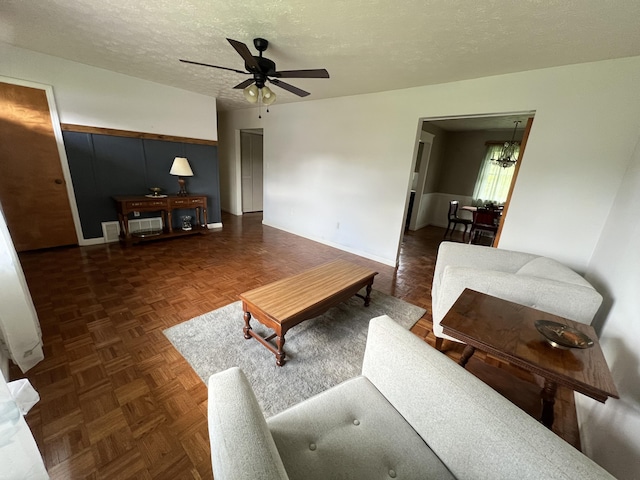 155 Greenfield Subdivision, Corbin, KY 40701 - living area featuring ceiling fan, a chandelier, a textured ceiling, and baseboards