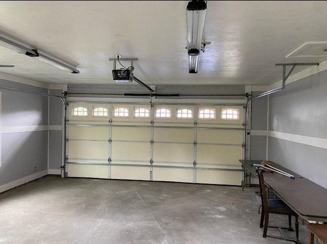 155 Greenfield Subdivision, Corbin, KY 40701 - garage with a garage door opener and baseboards