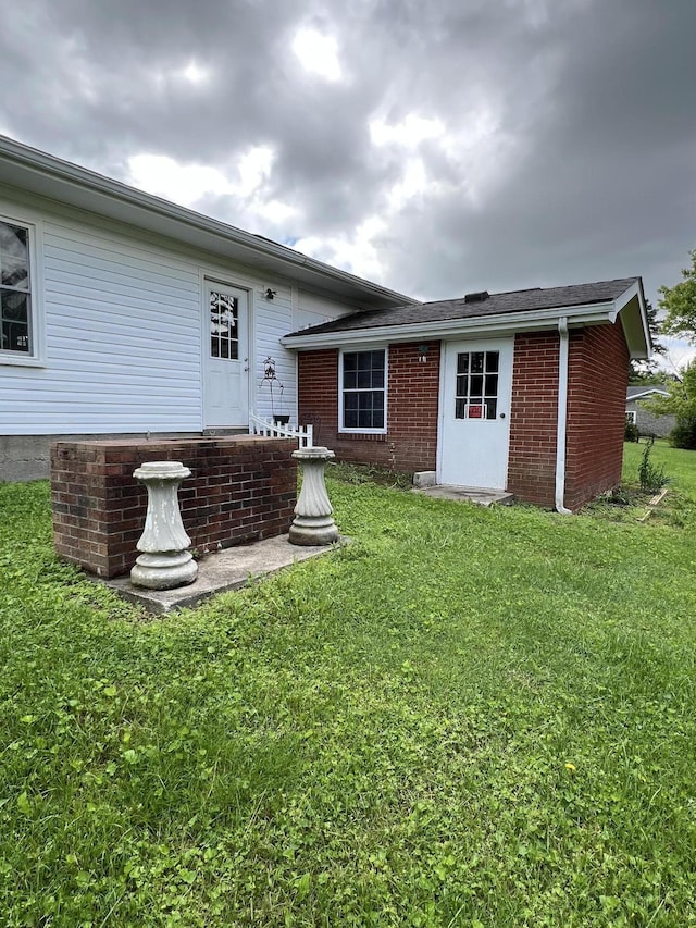 155 Greenfield Subdivision, Corbin, KY 40701 - back of property with a yard and brick siding