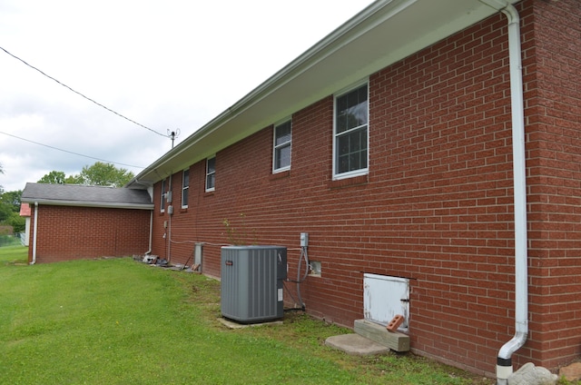 155 Greenfield Subdivision, Corbin, KY 40701 - view of property exterior with cooling unit, a lawn, and brick siding