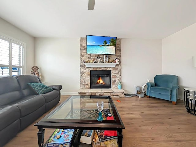 4663 Larkhill Ln, Lexington, KY 40509 - living area featuring wood finished floors, a fireplace, a ceiling fan, and baseboards