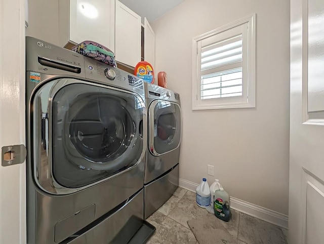 4663 Larkhill Ln, Lexington, KY 40509 - laundry room featuring separate washer and dryer, cabinet space, and baseboards