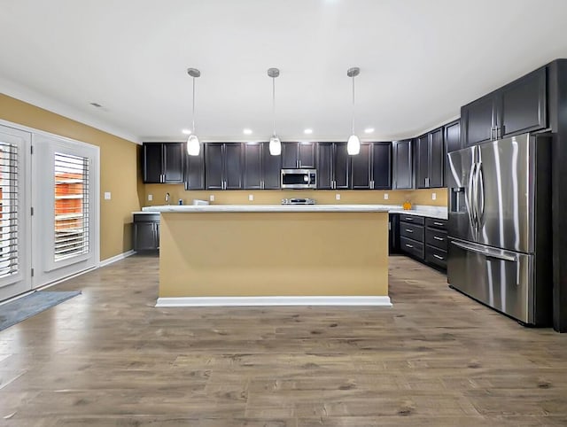 4663 Larkhill Ln, Lexington, KY 40509 - kitchen featuring stainless steel appliances, light countertops, wood finished floors, and recessed lighting