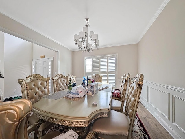 4663 Larkhill Ln, Lexington, KY 40509 - dining room featuring a chandelier, wood finished floors, ornamental molding, and wainscoting