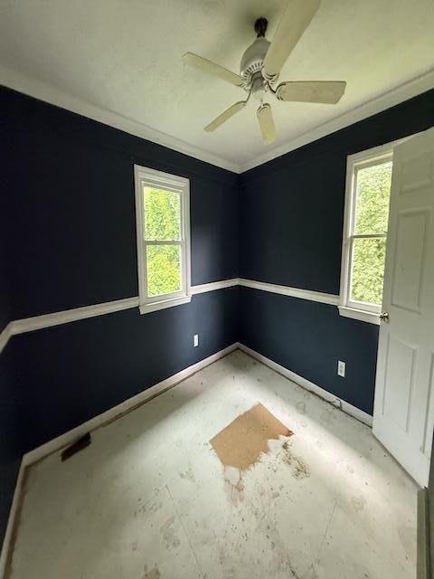 100 Ridgeway Dr, Lancaster, KY 40444 - spare room with crown molding, baseboards, and ceiling fan