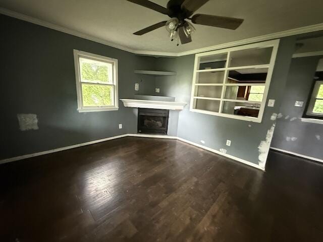 100 Ridgeway Dr, Lancaster, KY 40444 - unfurnished living room with ornamental molding, wood finished floors, ceiling fan, a glass covered fireplace, and baseboards