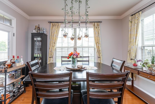 3757 Hardwood Rd, Lexington, KY 40509 - dining space featuring plenty of natural light, light wood finished floors, and ornamental molding
