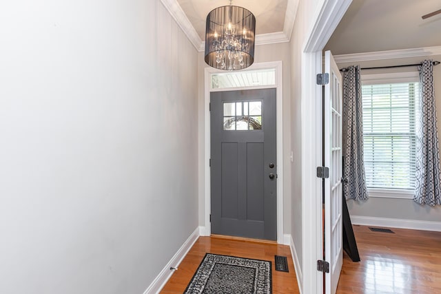 3757 Hardwood Rd, Lexington, KY 40509 - foyer with a chandelier, baseboards, wood finished floors, crown molding, and healthy amount of natural light