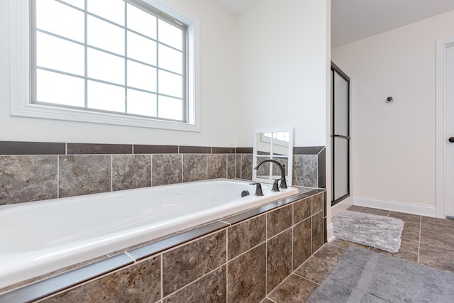 3757 Hardwood Rd, Lexington, KY 40509 - bathroom featuring a bath, a shower stall, baseboards, and tile patterned flooring