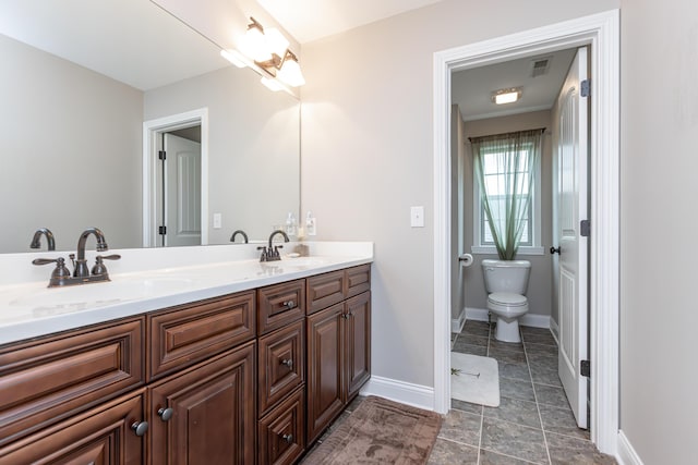 3757 Hardwood Rd, Lexington, KY 40509 - bathroom with double vanity, toilet, and baseboards