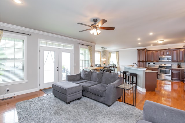 3757 Hardwood Rd, Lexington, KY 40509 - living room featuring ornamental molding, healthy amount of natural light, light wood-style flooring, ceiling fan, and recessed lighting