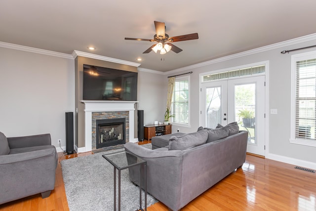 3757 Hardwood Rd, Lexington, KY 40509 - living area featuring light wood finished floors, a ceiling fan, ornamental molding, a fireplace, and baseboards