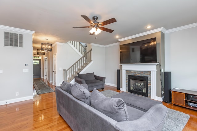 3757 Hardwood Rd, Lexington, KY 40509 - living area with ornamental molding, light wood-style floors, a fireplace, a ceiling fan, and recessed lighting