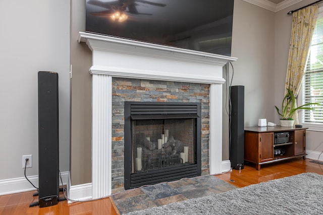3757 Hardwood Rd, Lexington, KY 40509 - detailed view of ornamental molding, a stone fireplace, wood finished floors, and baseboards