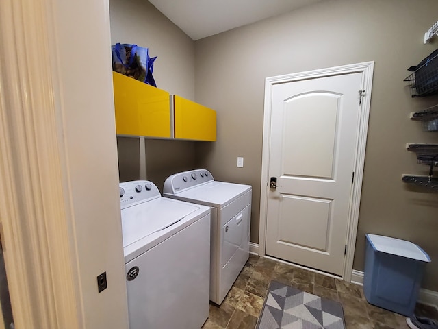227 Ikebana Dr, Georgetown, KY 40324 - laundry room with washing machine and clothes dryer, baseboards, and dark stone finish floors