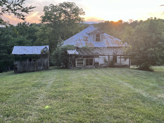 132 Harvieland Rd, Frankfort, KY 40601 - yard at dusk with an outbuilding and a yard