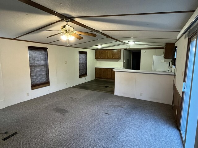 132 Harvieland Rd, Frankfort, KY 40601 - unfurnished living room featuring lofted ceiling, dark carpet, and ceiling fan