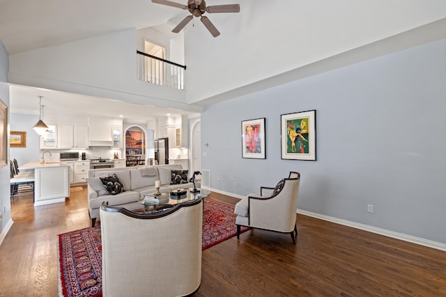 2293 Sunningdale Dr, Lexington, KY 40509 - living area featuring ceiling fan, wood finished floors, baseboards, arched walkways, and high vaulted ceiling