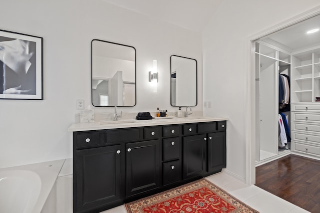 2293 Sunningdale Dr, Lexington, KY 40509 - full bath with double vanity, a walk in closet, and a garden tub
