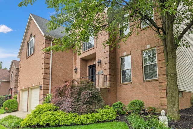 2293 Sunningdale Dr, Lexington, KY 40509 - view of building exterior featuring a garage and concrete driveway