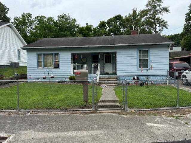 144 N Plum St, Irvine, KY 40336 - view of front of house featuring covered porch and a chimney