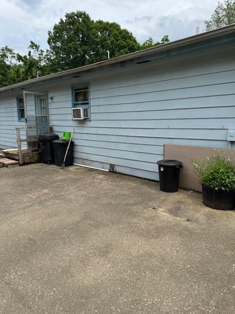 144 N Plum St, Irvine, KY 40336 - rear view of property with a patio area and cooling unit