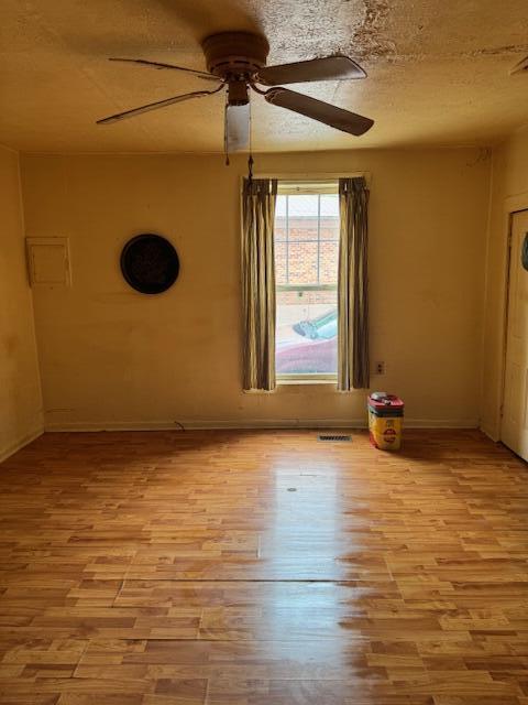 144 N Plum St, Irvine, KY 40336 - unfurnished room featuring ceiling fan, wood finished floors, and baseboards