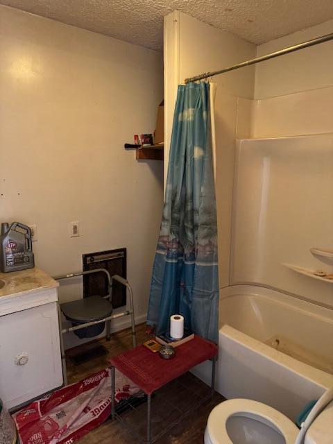 144 N Plum St, Irvine, KY 40336 - bathroom with a textured ceiling, toilet, shower / tub combo, and vanity