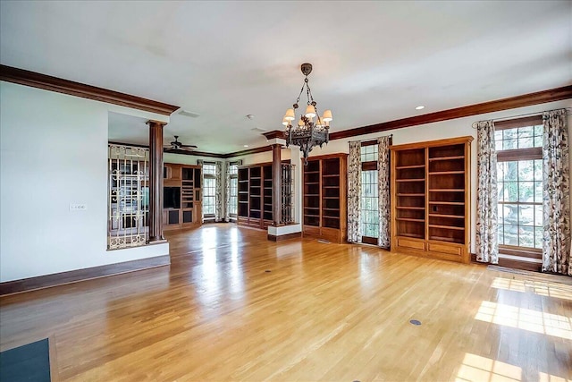 523 Leawood Dr, Frankfort, KY 40601 - unfurnished living room featuring ornamental molding, a chandelier, wood finished floors, a ceiling fan, and baseboards