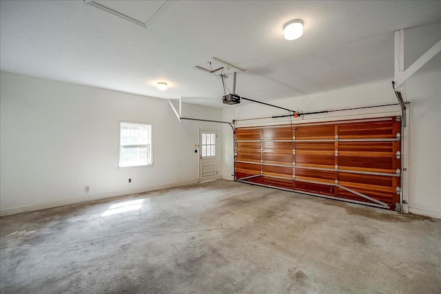 523 Leawood Dr, Frankfort, KY 40601 - garage with a garage door opener and baseboards
