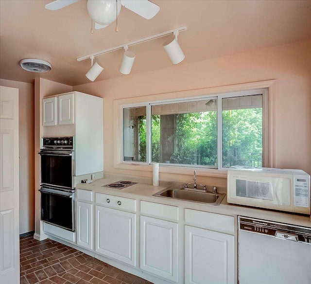 523 Leawood Dr, Frankfort, KY 40601 - kitchen featuring white appliances, a sink, healthy amount of natural light, and light countertops