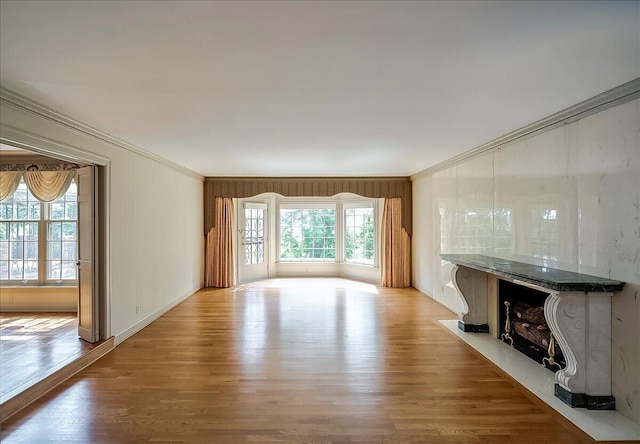 523 Leawood Dr, Frankfort, KY 40601 - unfurnished living room with a fireplace, ornamental molding, wood finished floors, and baseboards
