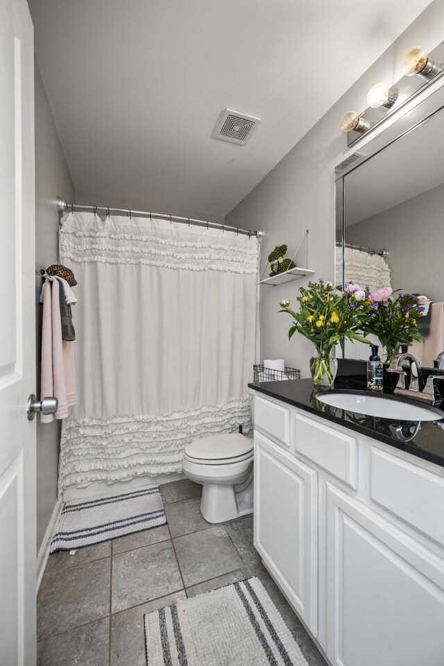 1017 Sugarbush Trl, Lexington, KY 40509 - bathroom with toilet, vanity, and baseboards